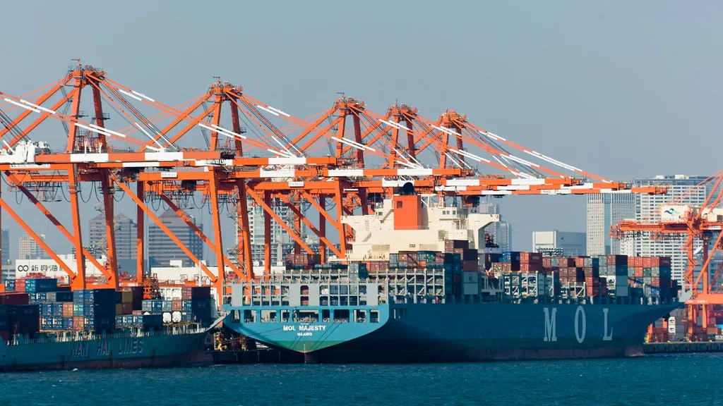 Container cranes and a loaded container ship at a port terminal