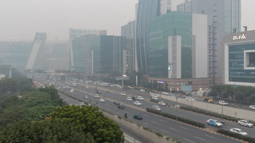 Office towers of Cyber City in Gurugram beside a busy highway